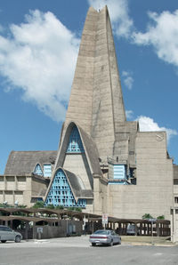 Low angle view of building against cloudy sky