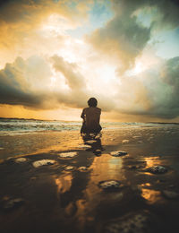  boy enjoying the sunset