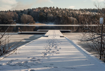 Scenic view of frozen lake against sky