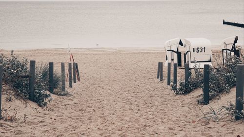 View of text on beach against sky