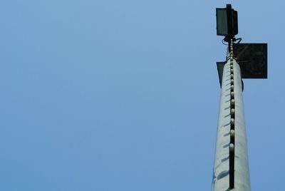 Low angle view of communications tower against clear sky