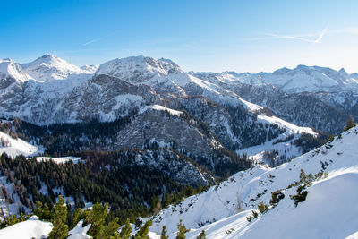 Scenic view of snow covered mountains against sky