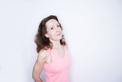 Portrait of a beautiful young woman over white background