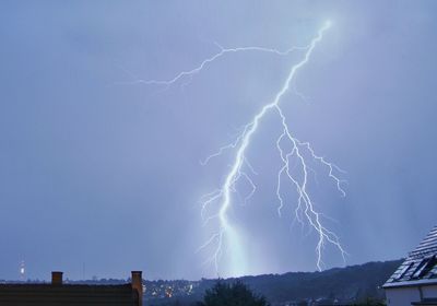 Low angle view of lightning against sky