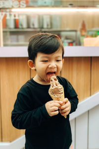 A boy is enjoying ice cream