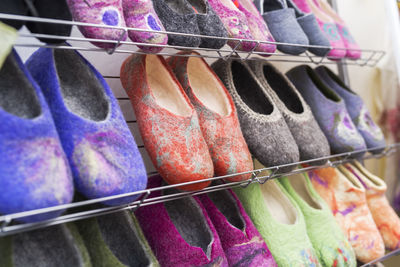 Close-up of multi colored clothes hanging on shelf