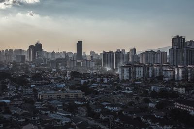  modern buildings in city against sky during sunset