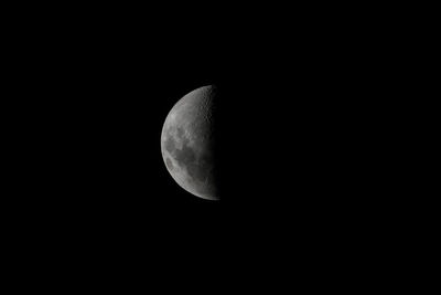 Low angle view of half moon against sky at night