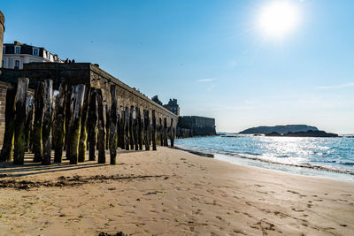 Panoramic shot of beach against sky on sunny day