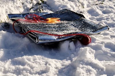 Self made sledge on a snow covered field