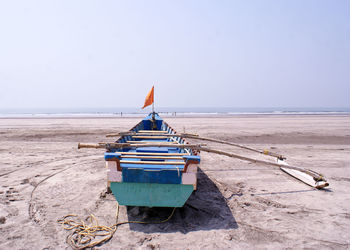 Lifeguard hut on beach against clear sky