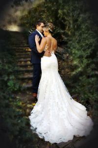 Rear view of mother and daughter in park