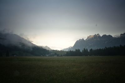 Scenic view of landscape and mountains against sky