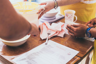 High angle view of people having food on table