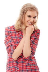 Portrait of a smiling young woman against white background