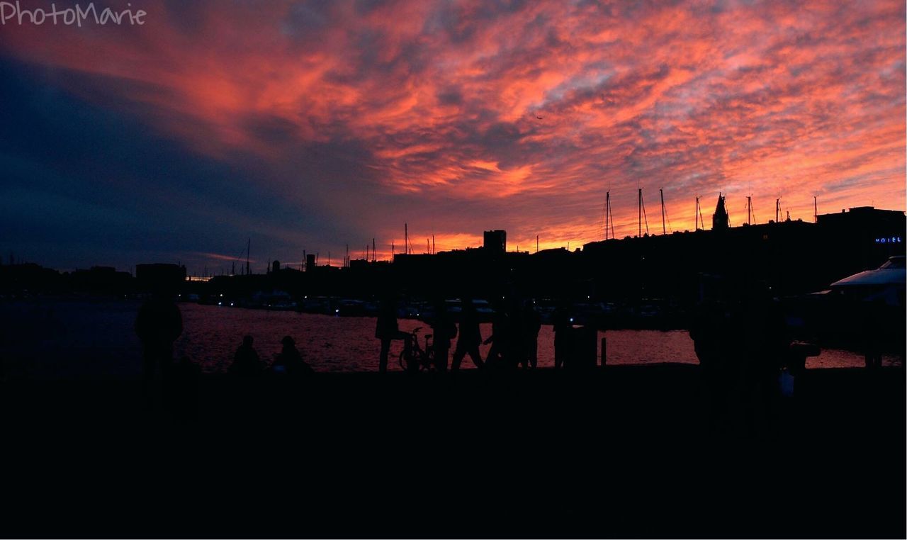 sunset, silhouette, sky, orange color, cloud - sky, built structure, dramatic sky, architecture, cloud, cloudy, building exterior, dark, nature, scenics, beauty in nature, men, dusk, outline, water