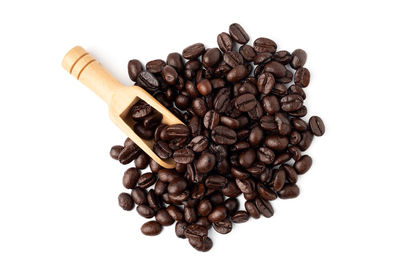 High angle view of coffee beans against white background