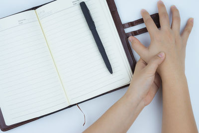 Close-up of hand holding book