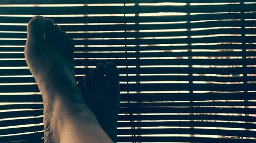 Low section of woman on tiled floor