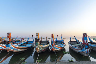 Boats moored at harbor