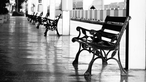 Empty chairs and tables in row