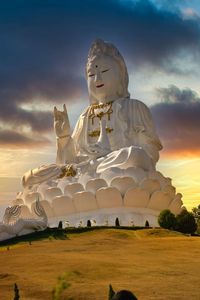 Statue against sky during sunset