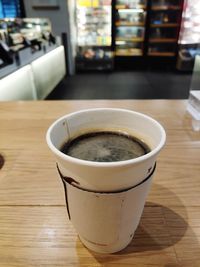 Close-up of coffee cup on table