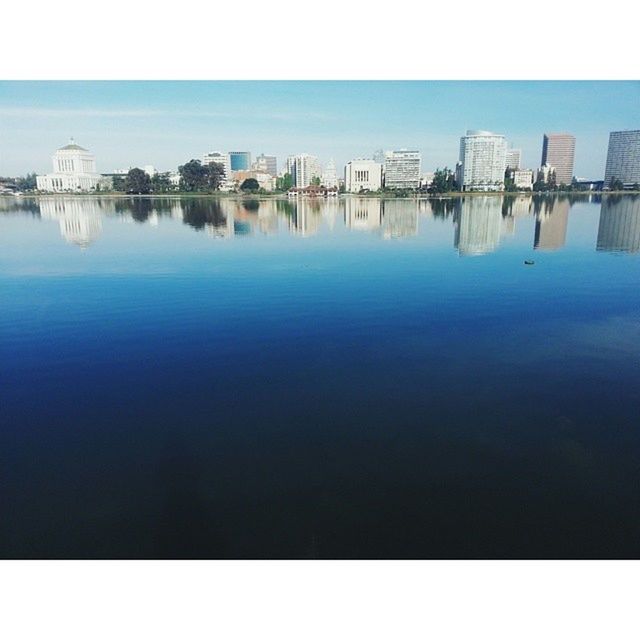 architecture, water, built structure, building exterior, blue, reflection, clear sky, waterfront, city, sea, copy space, river, lake, day, sky, cityscape, outdoors, building, standing water, no people