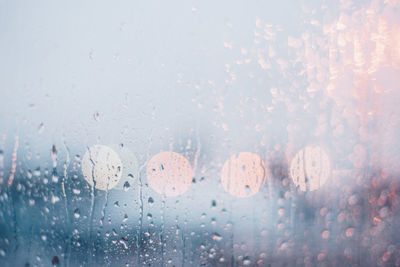 Close-up of raindrops on glass window
