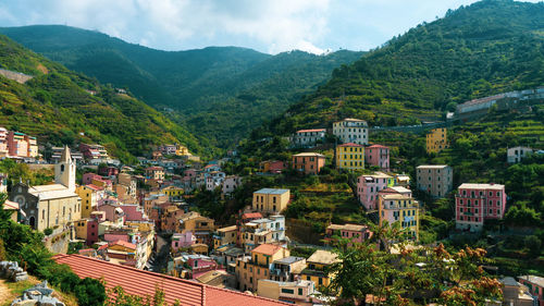 High angle view of townscape and mountains against sky