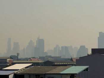 Buildings in city against sky