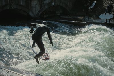 Woman jumping in water