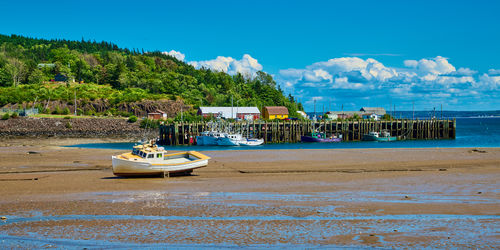 Boats in sea against sky