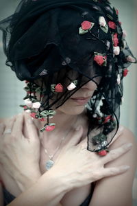 Close-up of woman holding flower