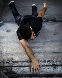 Full length of man skateboarding on ground