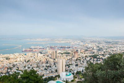 High angle view of city buildings against sky