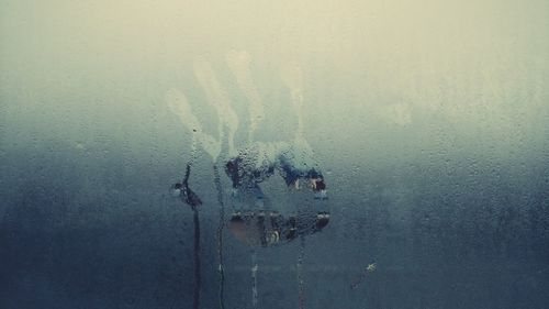 Close-up of water drops on condensed glass