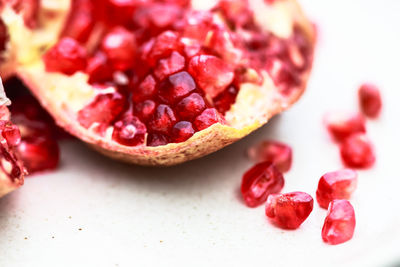 Close-up of pomegranate on white background