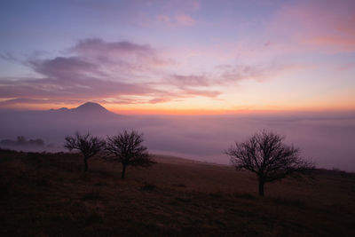 Scenic view of silhouette landscape against sky during sunset