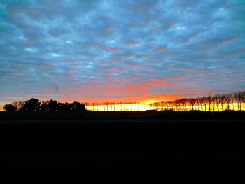 Scenic view of silhouette landscape against sky during sunset