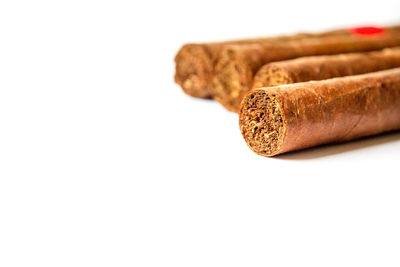 Close-up of cigarette against white background