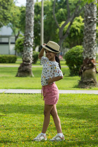 Full length of woman standing on field