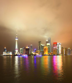 Illuminated buildings in city at night