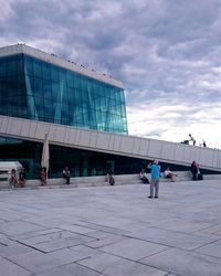 View of buildings against cloudy sky