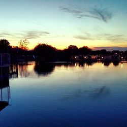 Scenic view of lake at sunset