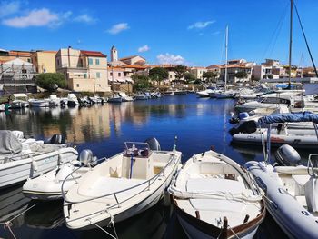 Boats moored at harbor