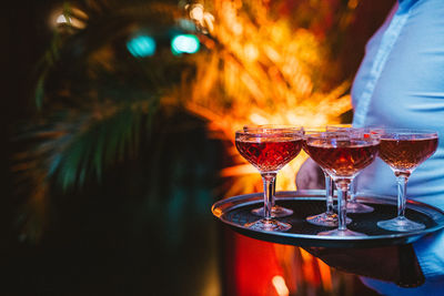 Close-up of wine glasses on table