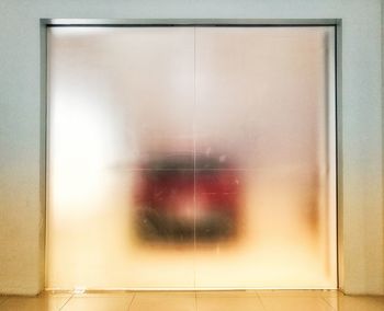 Close-up of glass window on wall