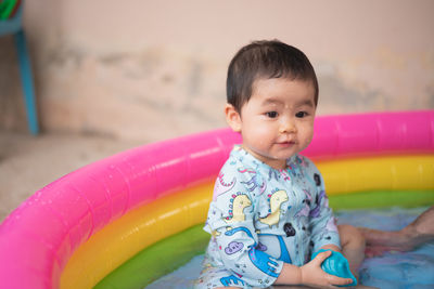 Close-up of cute boy looking away