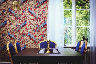 View of chairs at dining table in the house